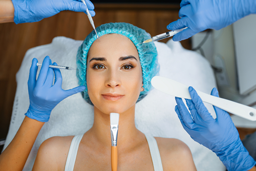 cosmetician hands with working tools patient face 2023 11 27 05 25 56 utc 1 a woman getting a botox injection