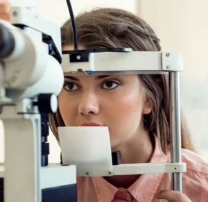 A patient undergoing a professional vision test to determine how long does an eye exam take at a specialist clinic.