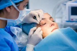 lower blepharoplasty eyelid surgery procedure showing surgeon performing precise under-eye correction in a sterile clinical setting